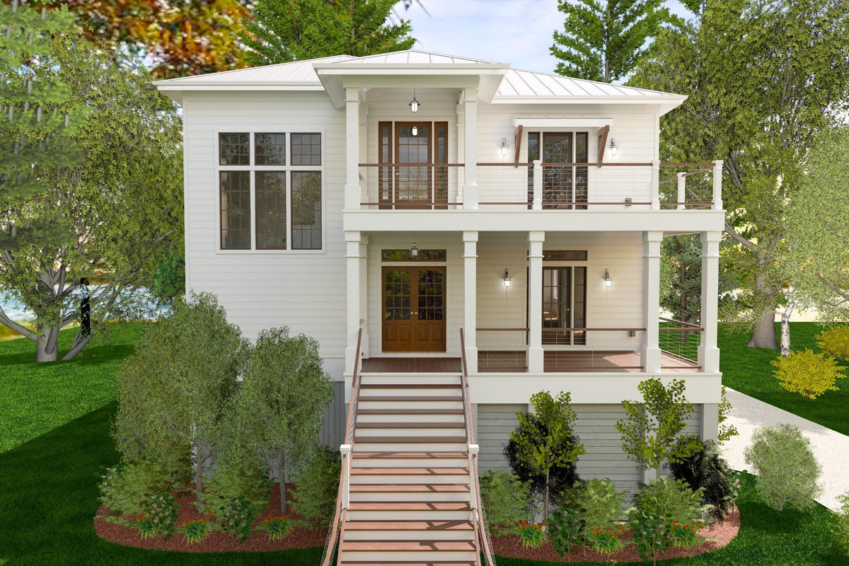 An elevated coastal house seen from the front, raised on a ground level with parking beneath.