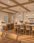 Kitchen in Islabella, with a long island seating four under pendant lights, a second island with a sink and wine cooler, and tall cabinets beside the refrigerator.