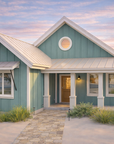 The Wave II - Coastal Cottage House Plan - Sunset Front Exterior View - Intertwine House Plans